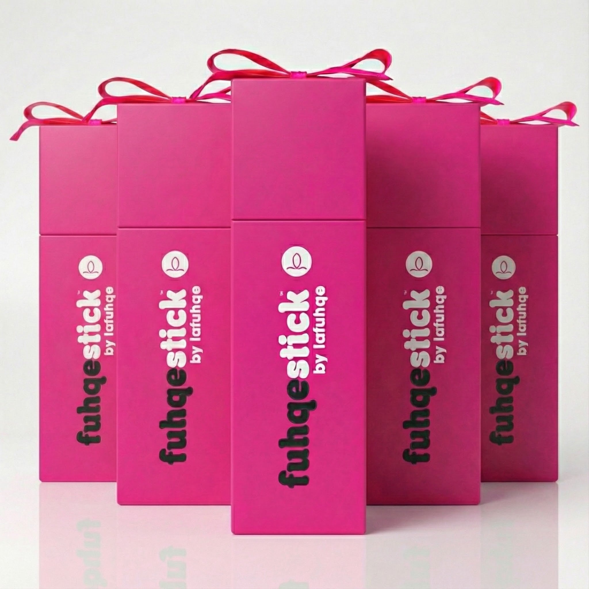 Pink packaging boxes with 'fuhqestick by lafuhqe' branding on a light pink background