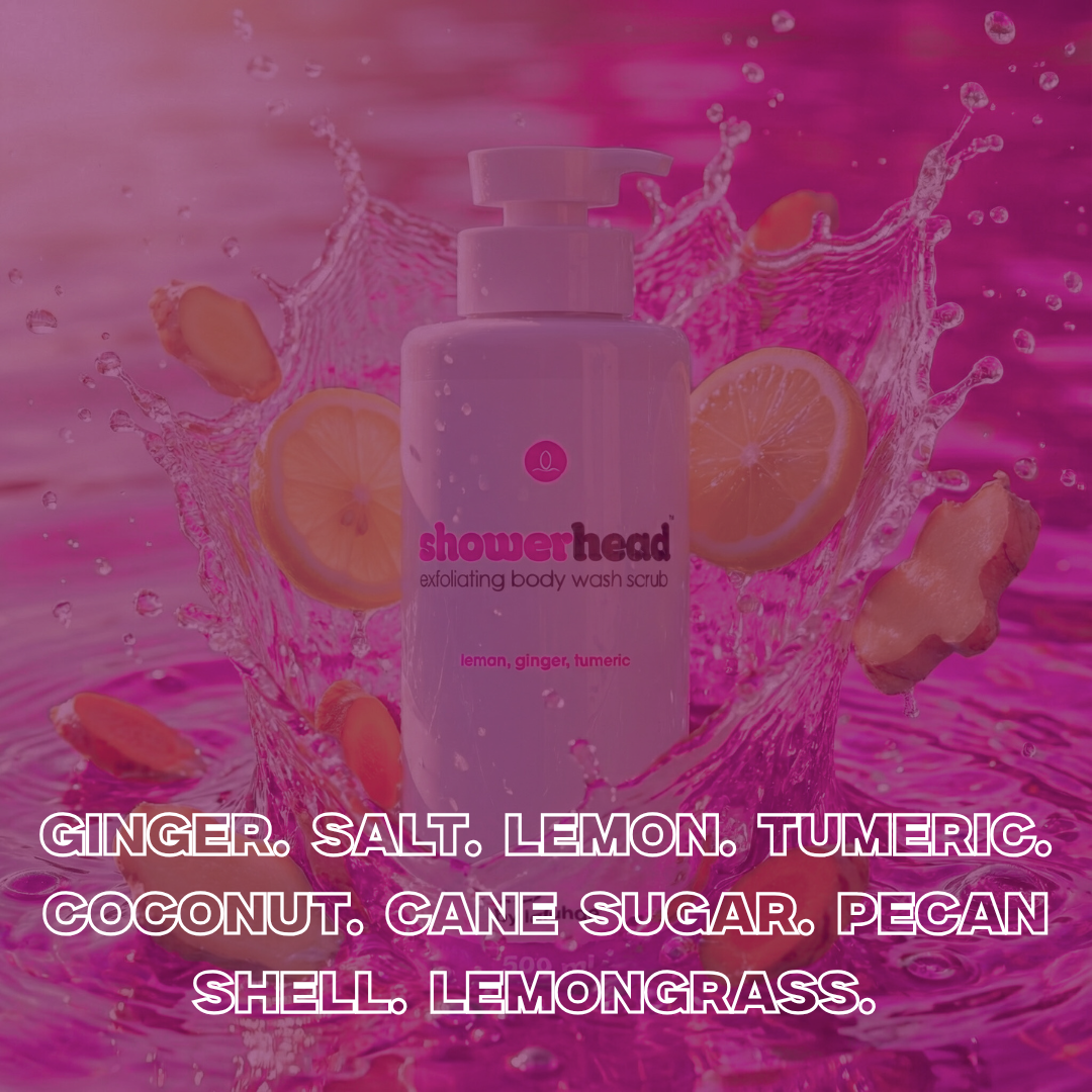 Showerhead body wash scrub bottle with ingredients listed on a pink water splash background