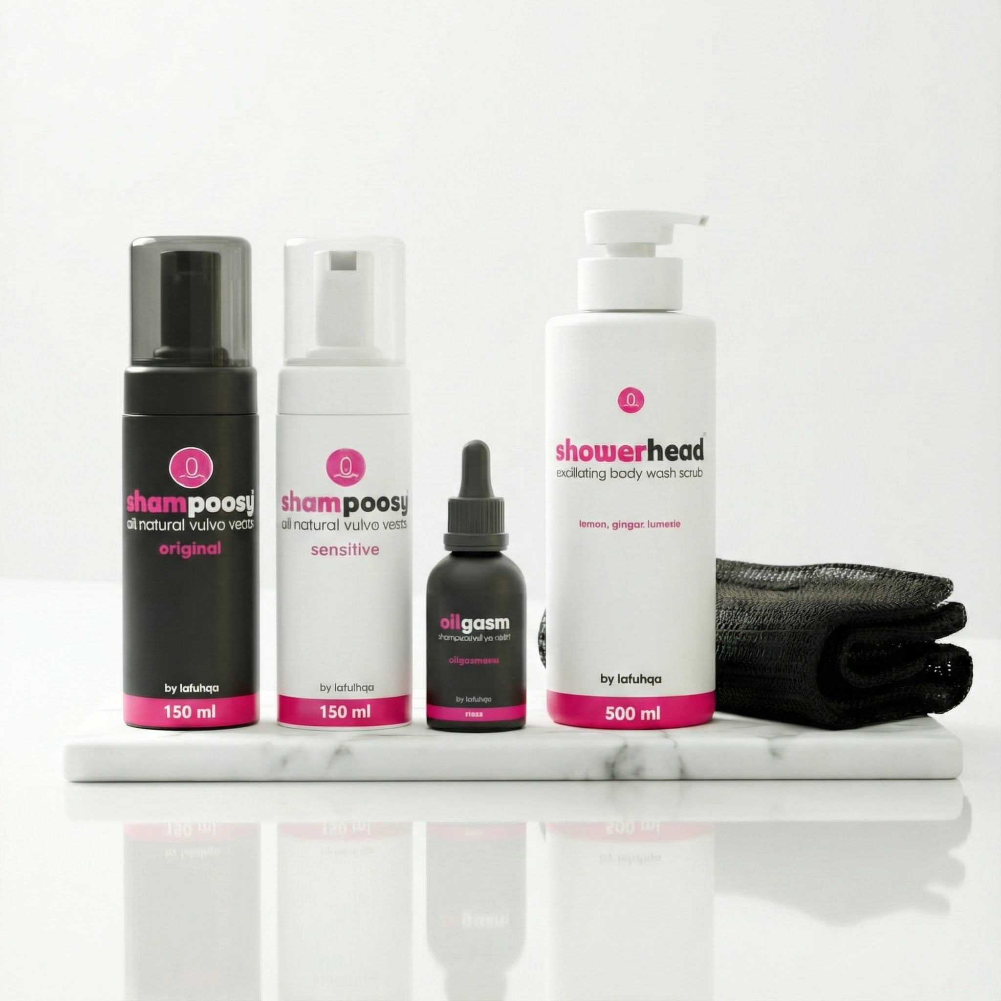 Set of skincare products including bottles and a black cloth on a white surface with a light gray background.